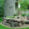 Residential boulder wall in Savage